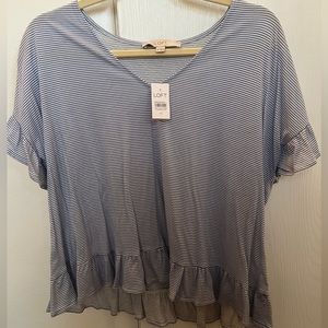 Ruffle sleeve tee shirt.